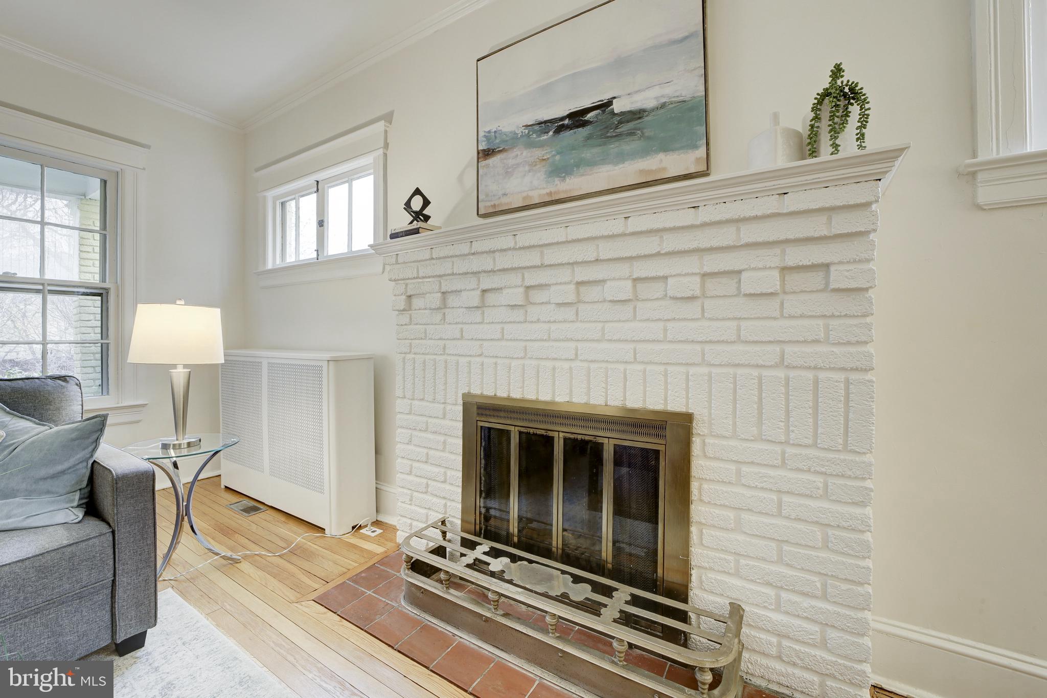 2849 29th Street Northwest Washington, DC 20008 - Photo 9 of 38 a living room with furniture and a fireplace