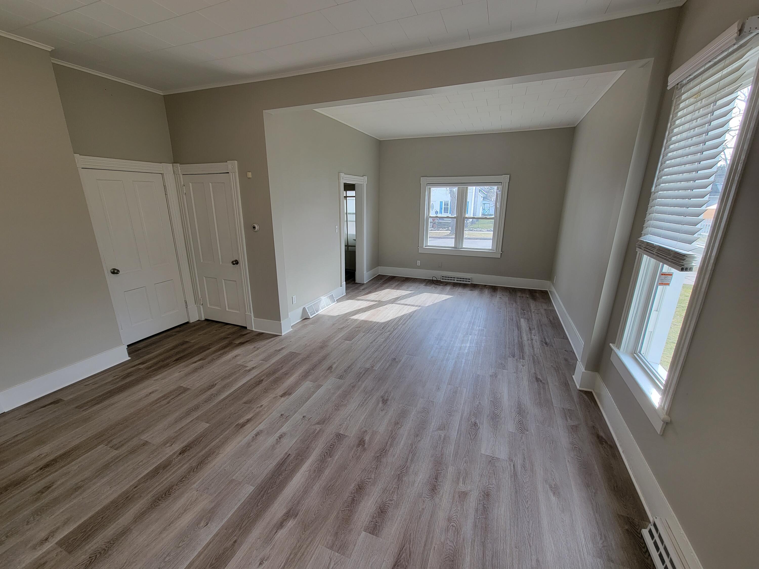258 3rd Street Manistee, MI 49660 - Photo 5 of 26 20230220_142814 Dining & Living Rm
