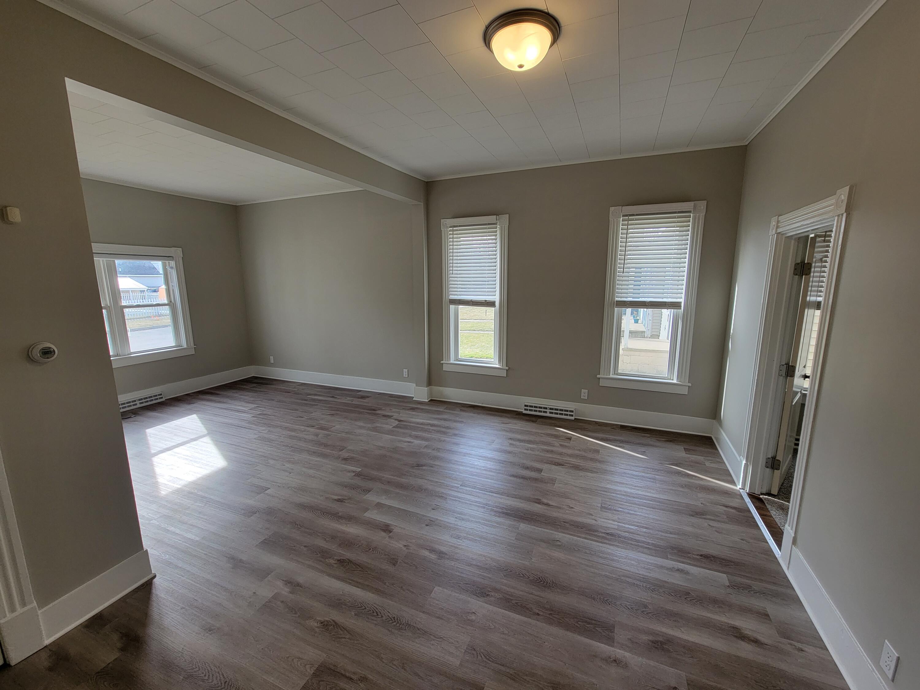 258 3rd Street Manistee, MI 49660 - Photo 6 of 26 20230220_142829 Dining & Living Rm (1)