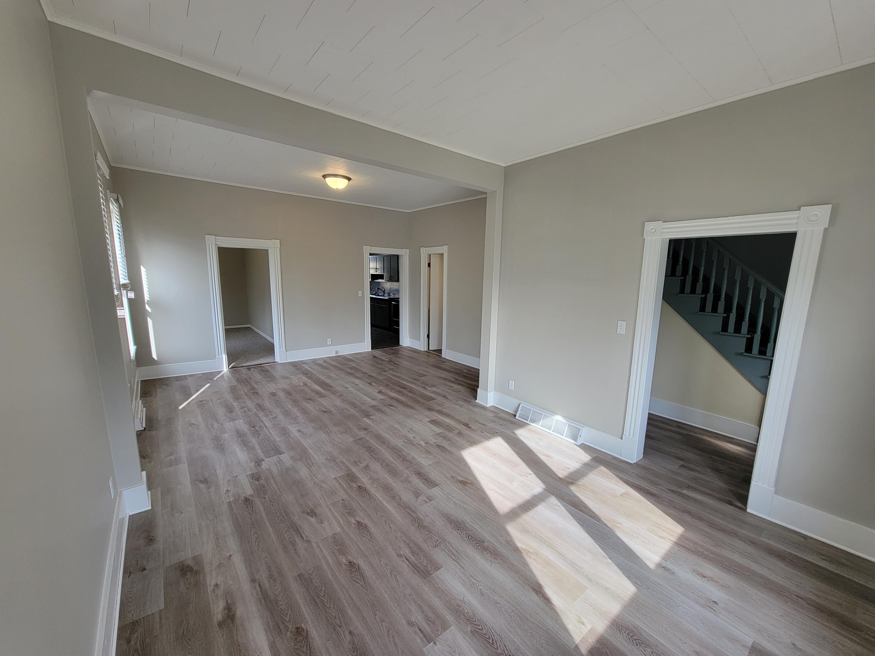 258 3rd Street Manistee, MI 49660 - Photo 7 of 26 20230220_142842 Dining & Living Rm (2)
