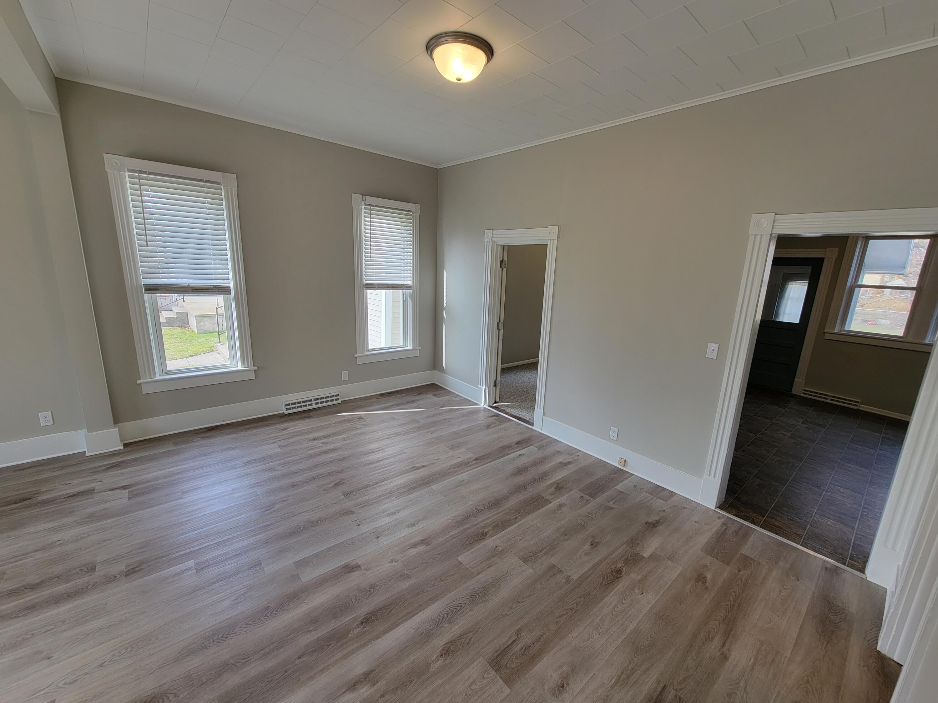 258 3rd Street Manistee, MI 49660 - Photo 8 of 26 20230220_142852 Dining & Living Rm (3)
