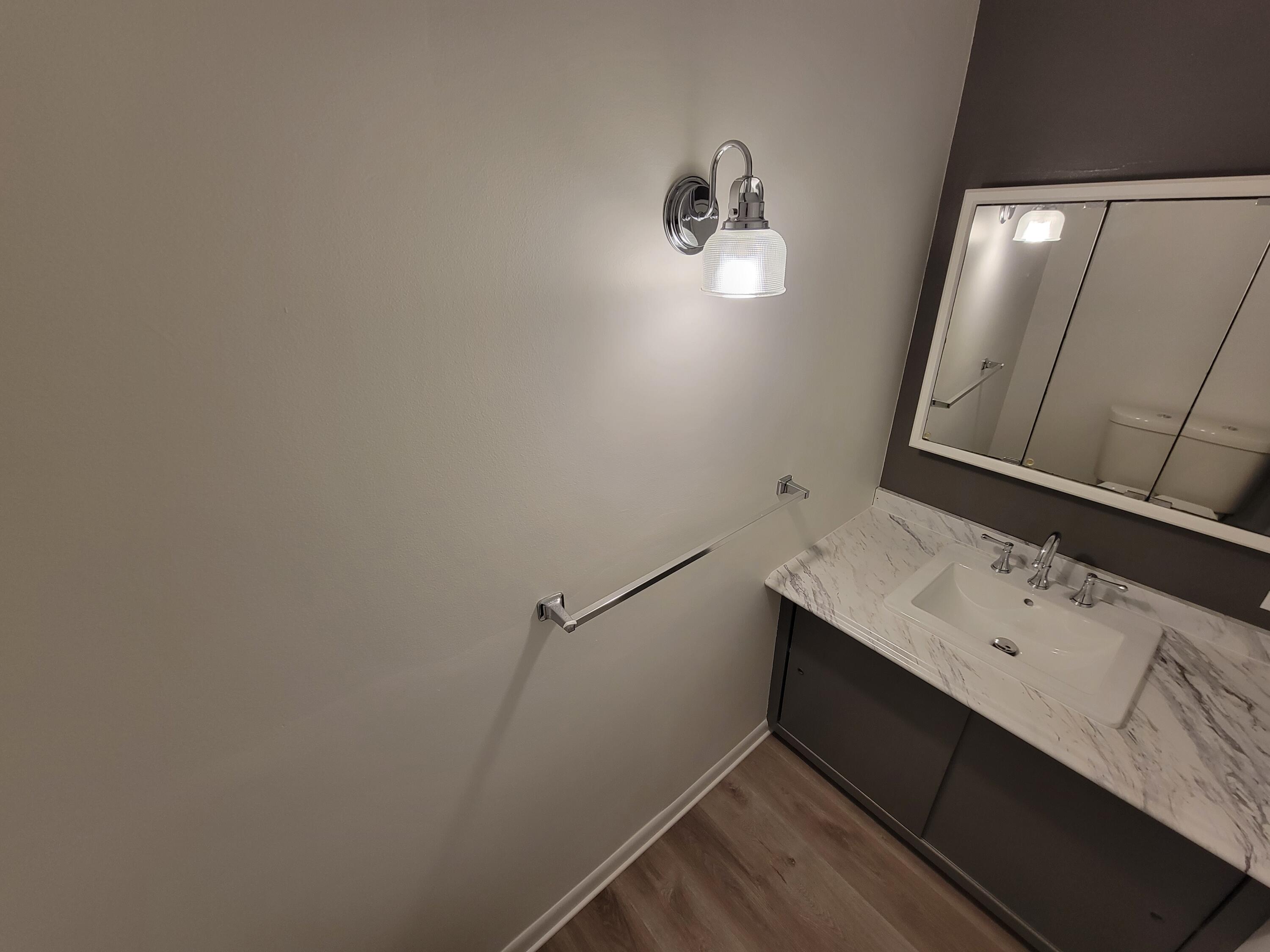 258 3rd Street Manistee, MI 49660 - Photo 9 of 26 20230220_142924 Half Bath lower