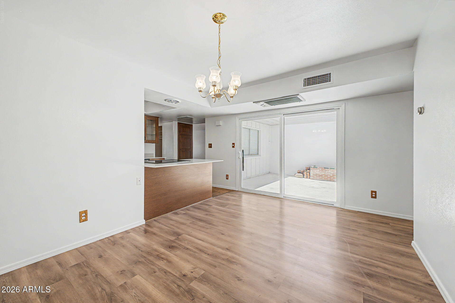 5873 East Thomas Road Scottsdale, AZ 85251 - Photo 7 of 30 a view of a room with wooden floor and ceiling fan