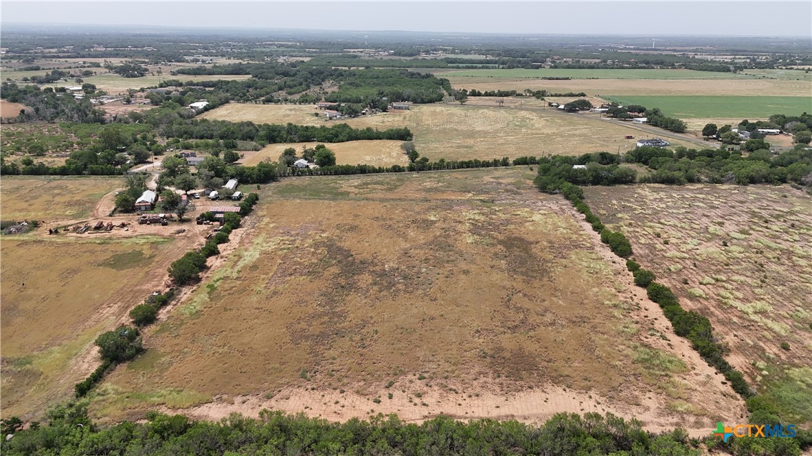 10945 Dillon Road Atascosa, TX 78002 - Photo 12 of 17 an aerial view of a house with a lake view