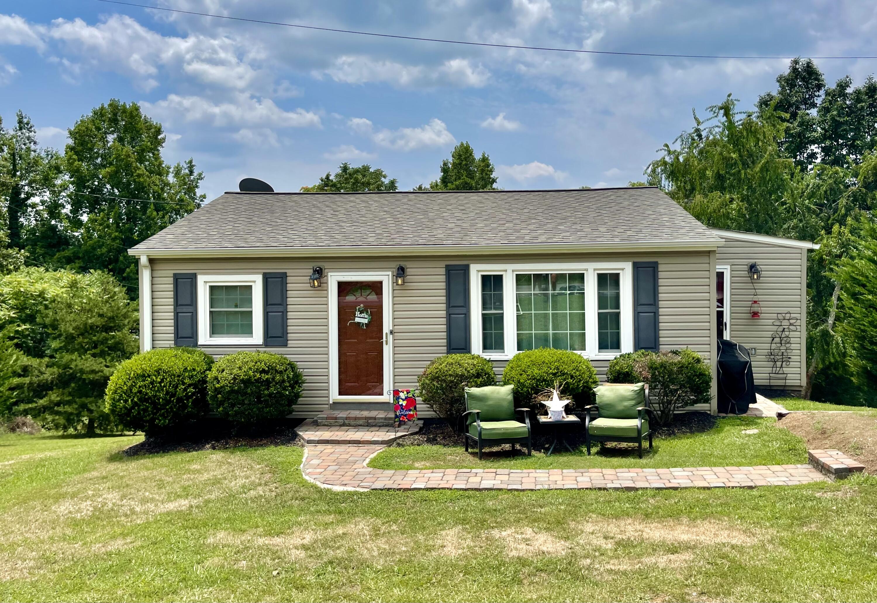 171 Oak Forest Road Bassett, VA 24055 - Photo 1 of 13 a front view of a house with a yard and outdoor seating
