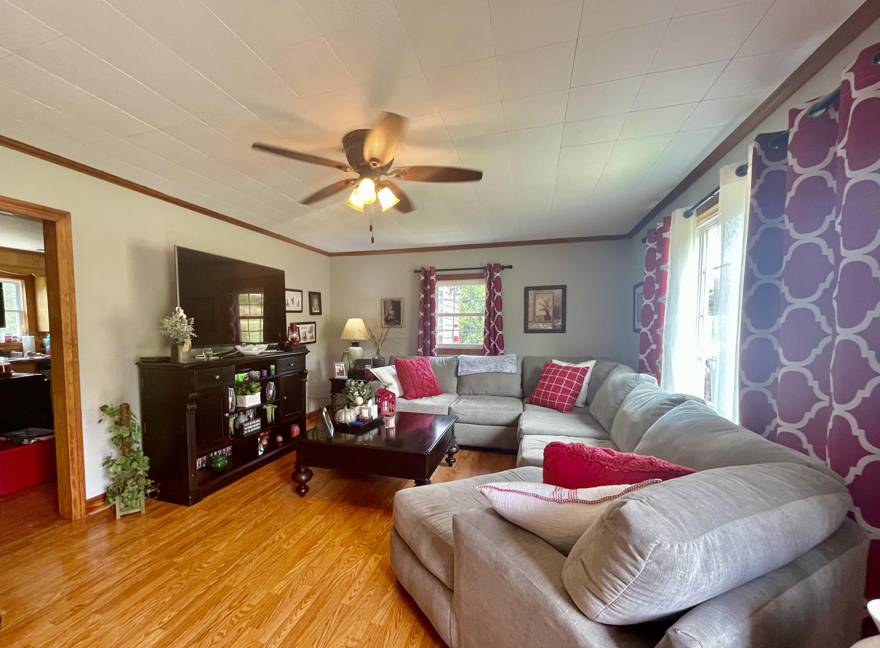 171 Oak Forest Road Bassett, VA 24055 - Photo 3 of 13 a living room with furniture and a flat screen tv