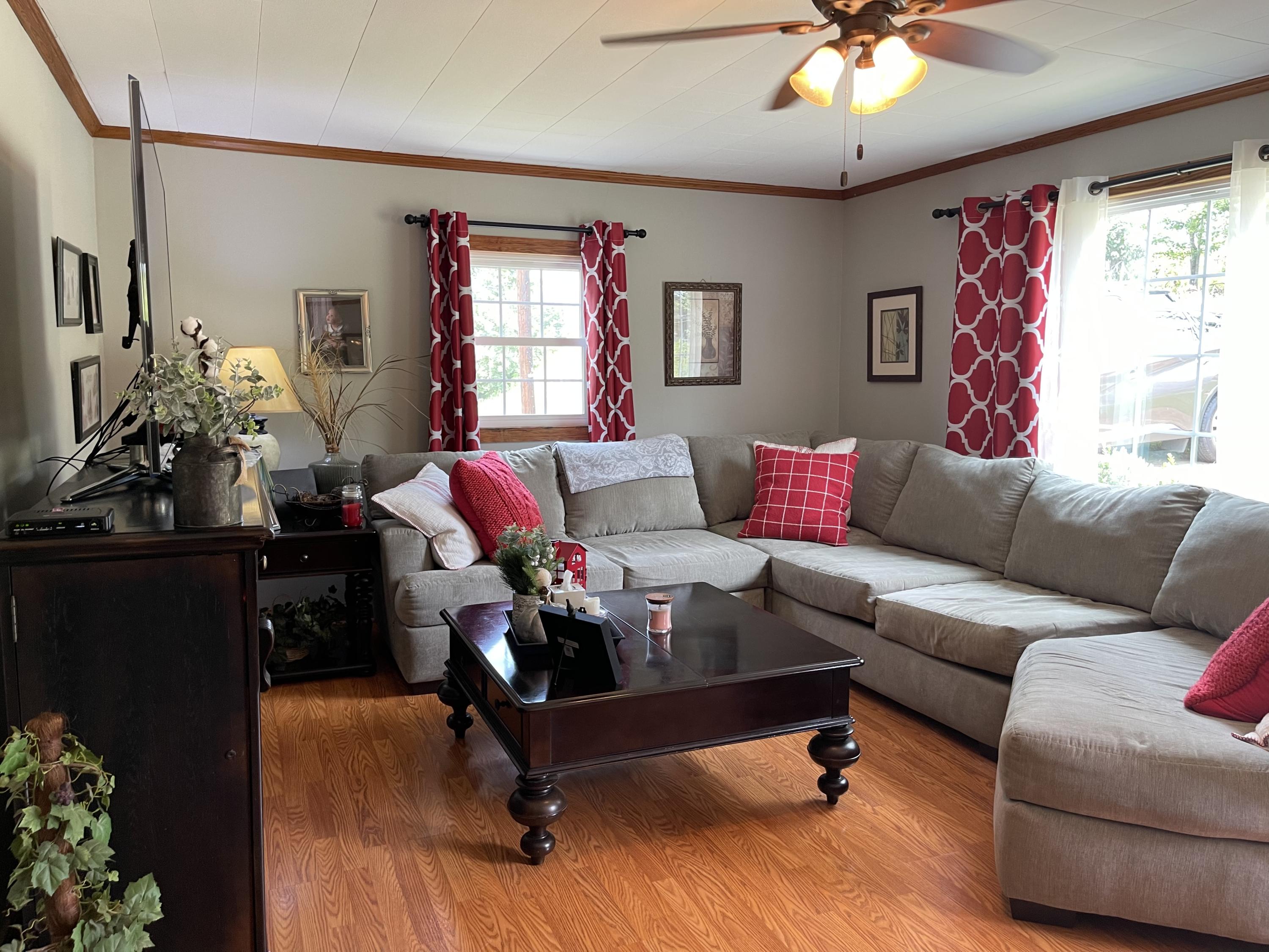 171 Oak Forest Road Bassett, VA 24055 - Photo 4 of 13 a living room with furniture and flowers