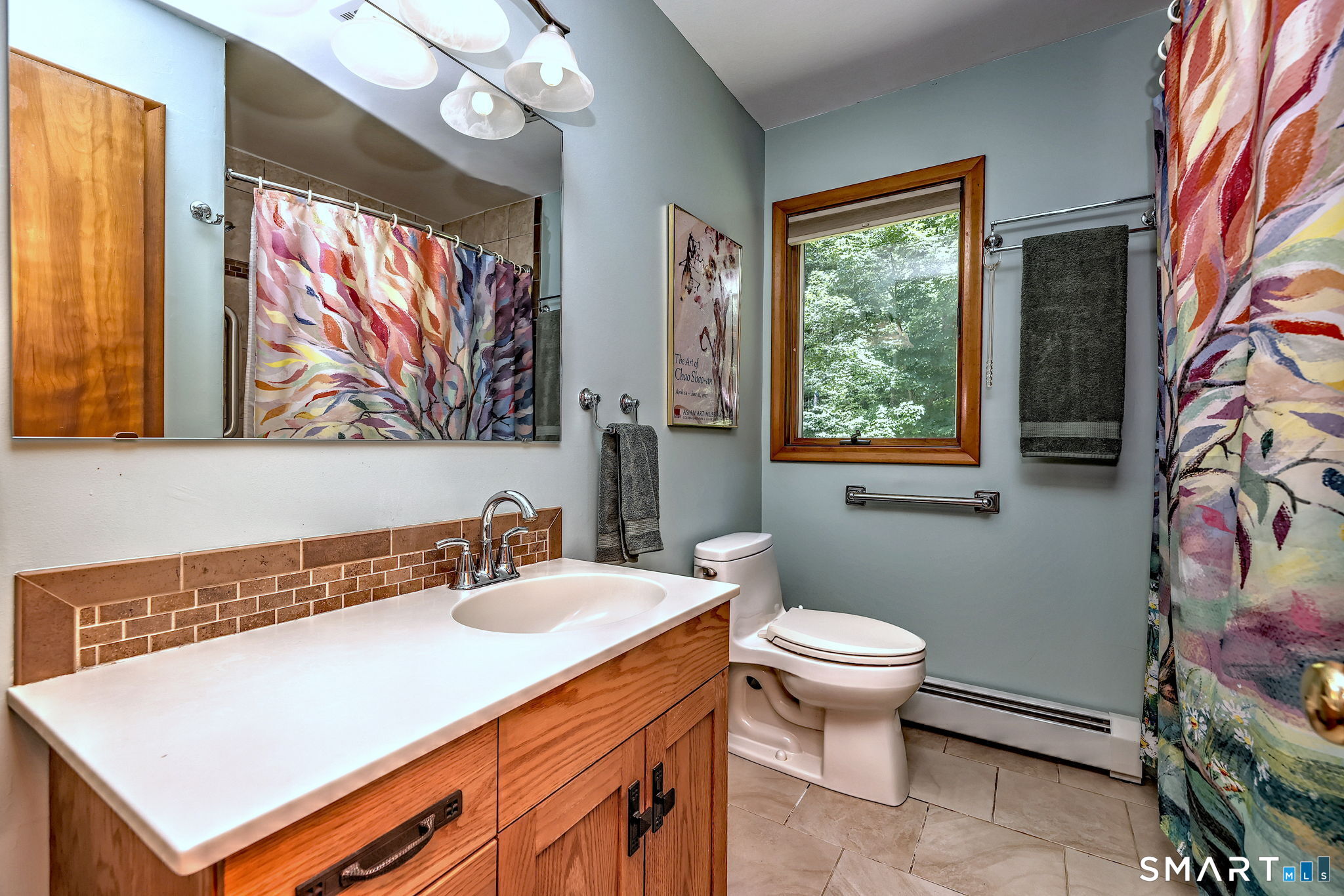 25 Mountain View Road Bethany, CT 06524 - Photo 18 of 27 Main floor full bath features large mirror, countertop area and window.