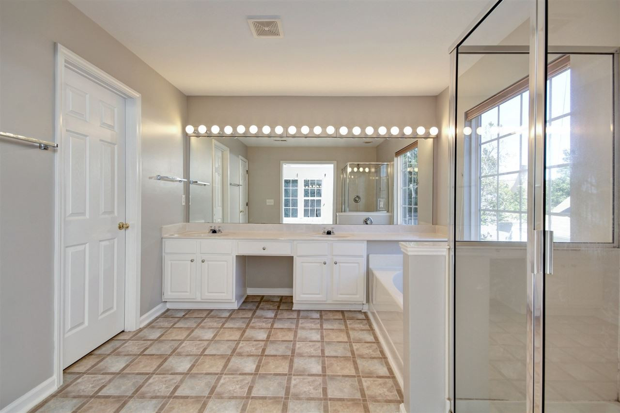 7444 Lagrange Drive Raleigh, NC 27613 - Photo 18 of 30 Luxurious master bath with dual vanity, stand alone shower and garden tub. Very big walk in closet and separate water closet. Master En Suite