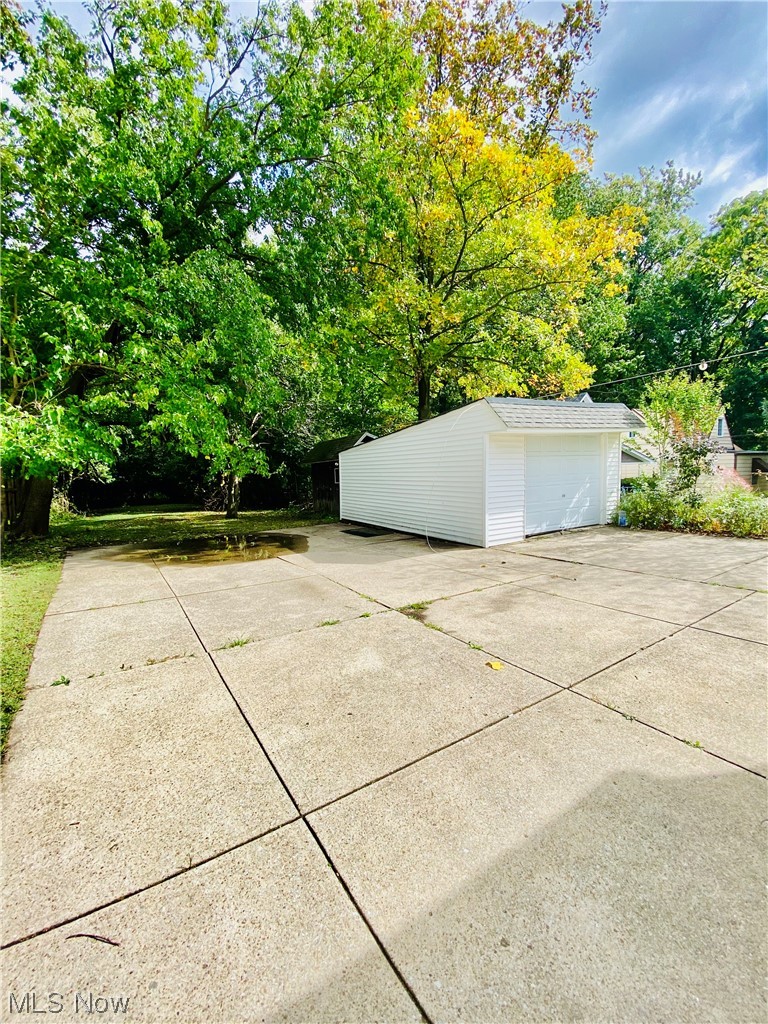 3683 Highland Road Cleveland, OH 44111 - Photo 16 of 17 View of terrace featuring a garage