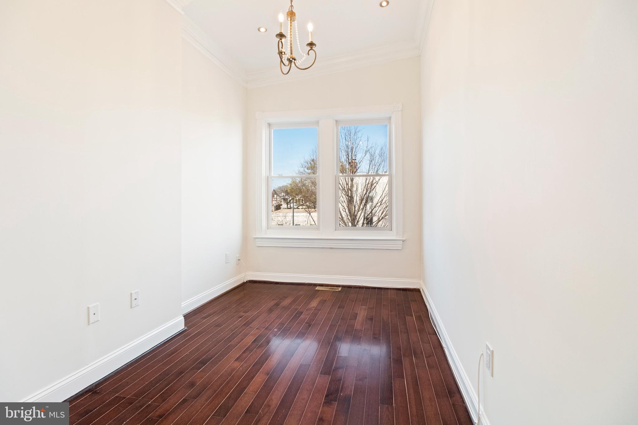 801 East Capitol Street Southeast Washington, DC 20003 - Photo 15 of 29 a view of a hallway with wooden floor and a window