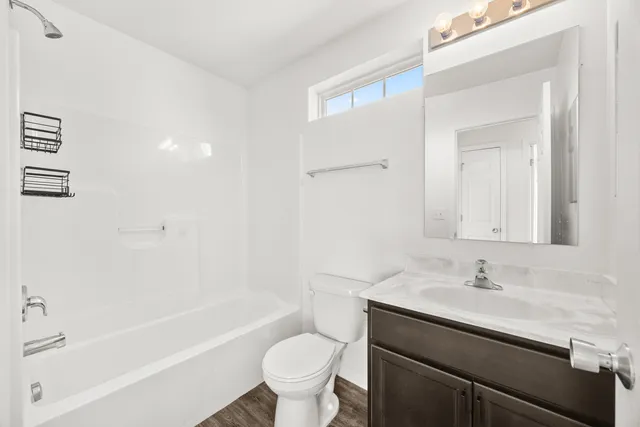 a bathroom with a sink a toilet and a bathtub