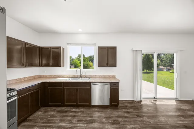 a kitchen with a sink and a stove top oven