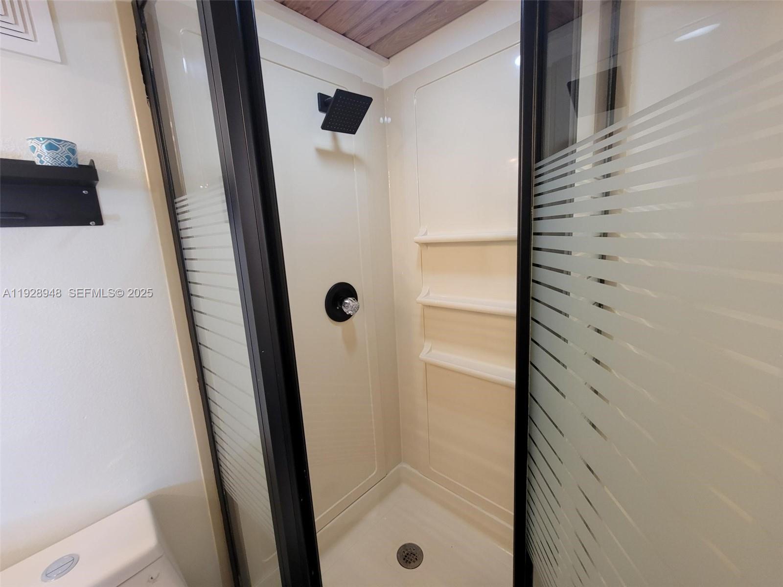 11375 Southwest 112th Cir Lane South Miami, FL 33176 - Photo 12 of 55 a bathroom with a shower and a sink