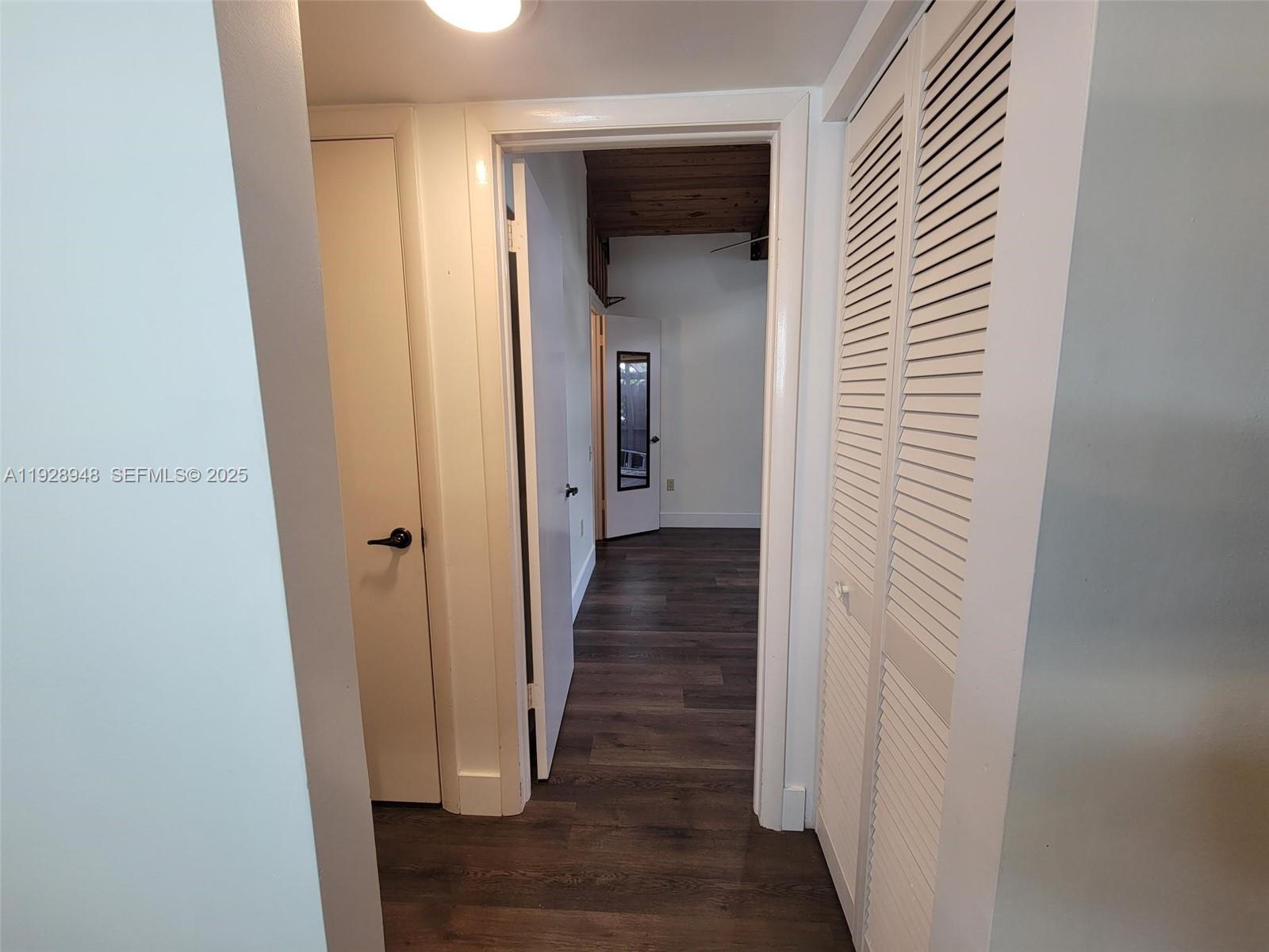 11375 Southwest 112th Cir Lane South Miami, FL 33176 - Photo 14 of 55 a view of a hallway with wooden floor