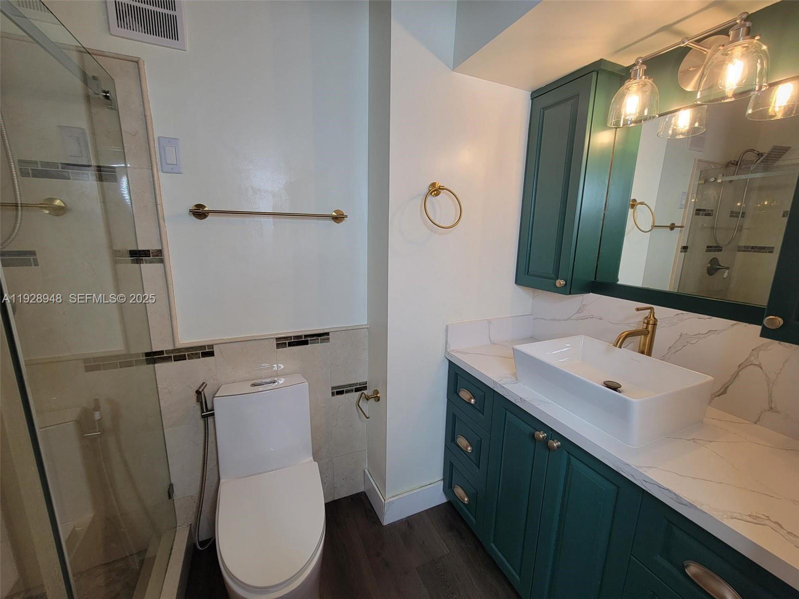 11375 Southwest 112th Cir Lane South Miami, FL 33176 - Photo 37 of 55 a bathroom with a toilet sink and mirror