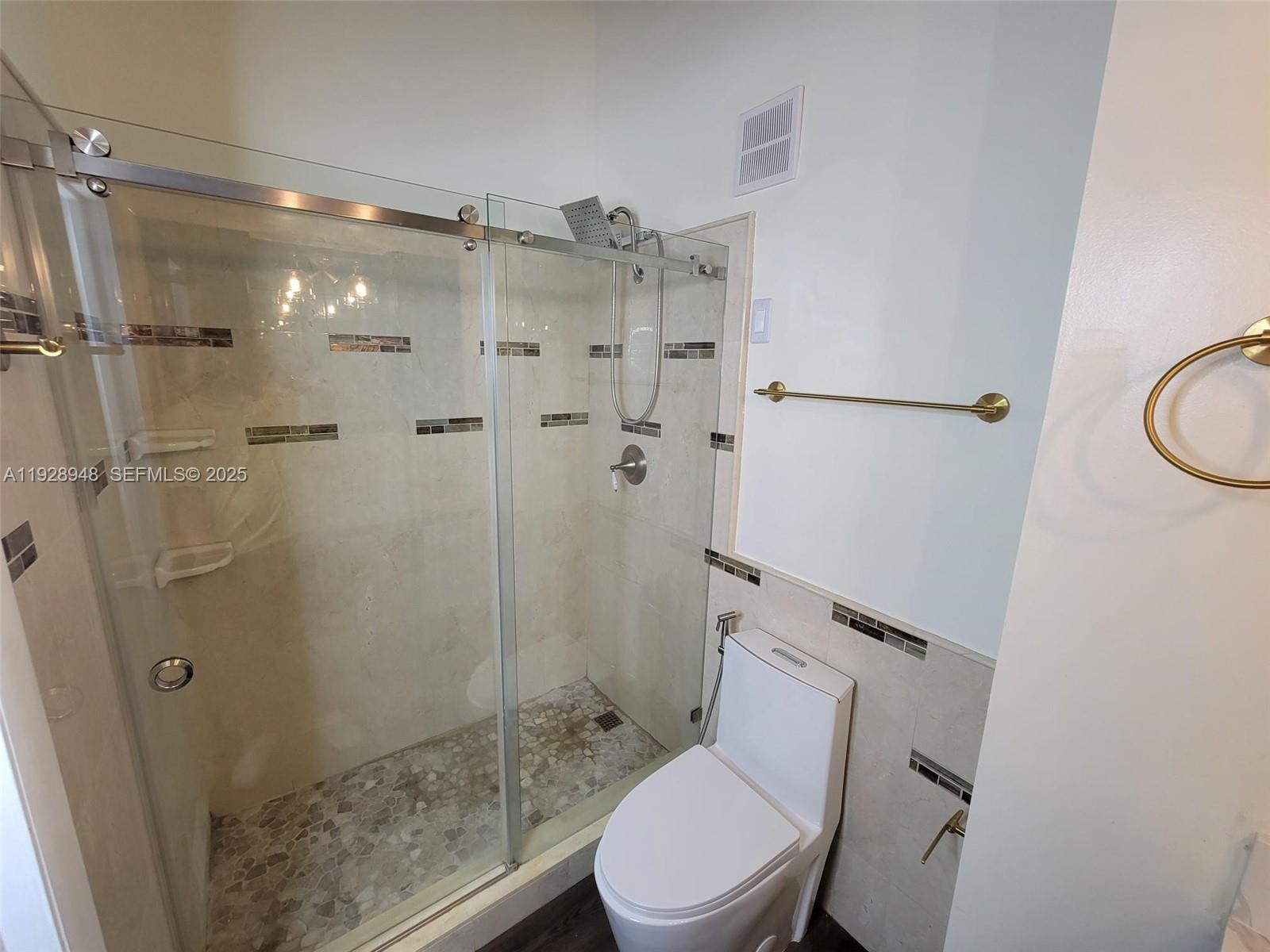 11375 Southwest 112th Cir Lane South Miami, FL 33176 - Photo 38 of 55 a bathroom with a shower toilet and sink