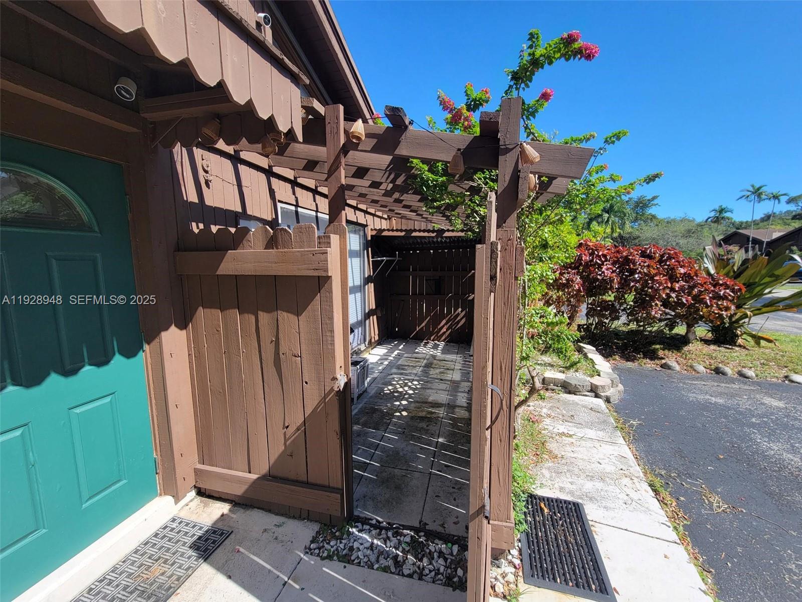 11375 Southwest 112th Cir Lane South Miami, FL 33176 - Photo 4 of 55 a view of a pathway of a house