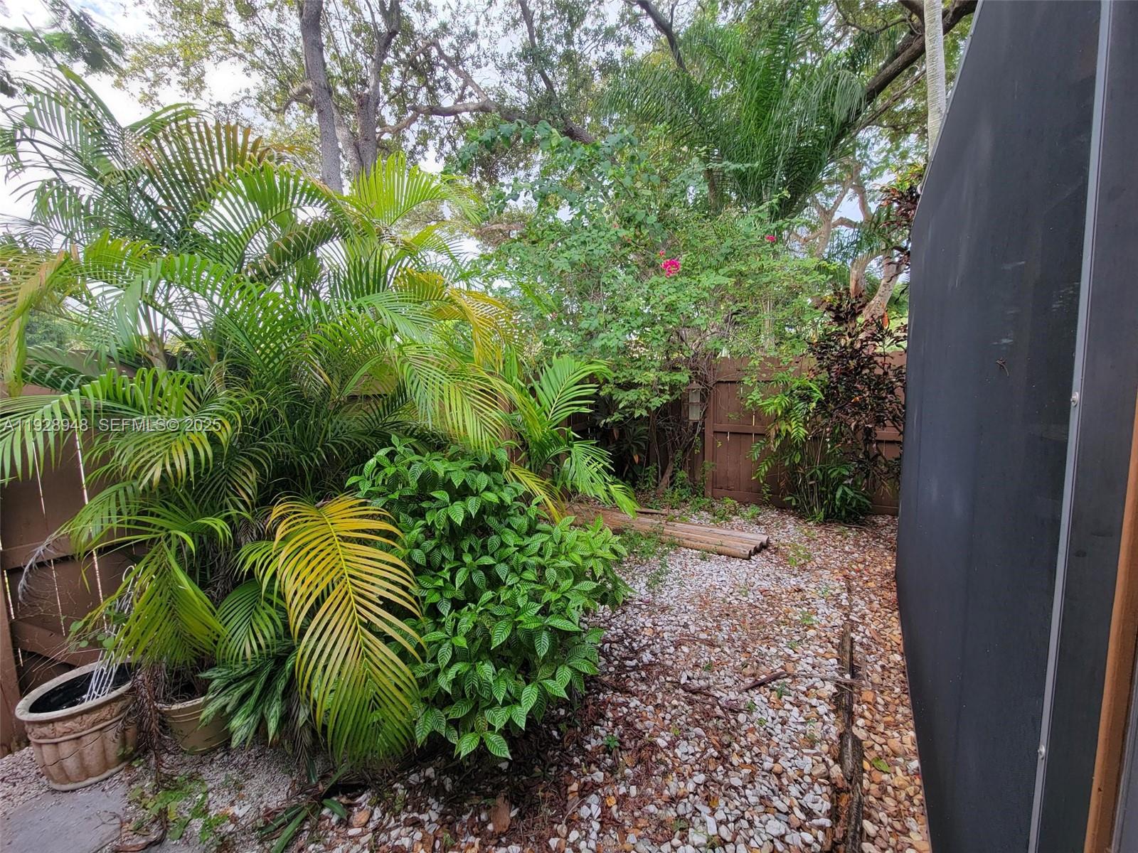11375 Southwest 112th Cir Lane South Miami, FL 33176 - Photo 45 of 55 a backyard of a house with lots of green space