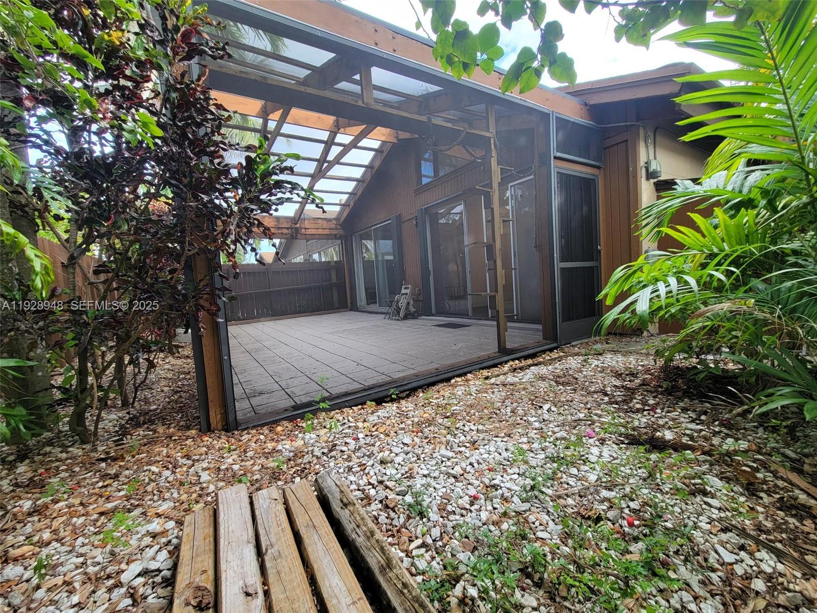 11375 Southwest 112th Cir Lane South Miami, FL 33176 - Photo 47 of 55 a front view of a house with a yard