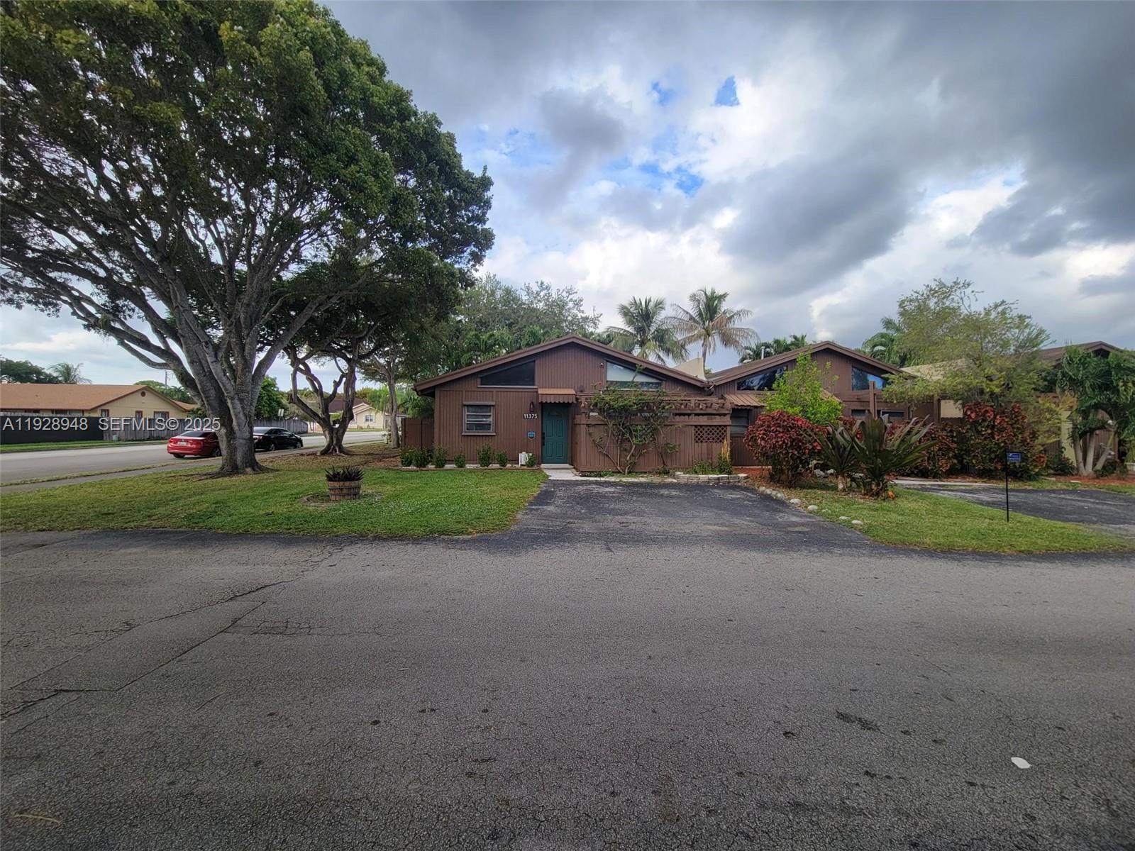 11375 Southwest 112th Cir Lane South Miami, FL 33176 - Photo 53 of 55 a view of a house with a yard