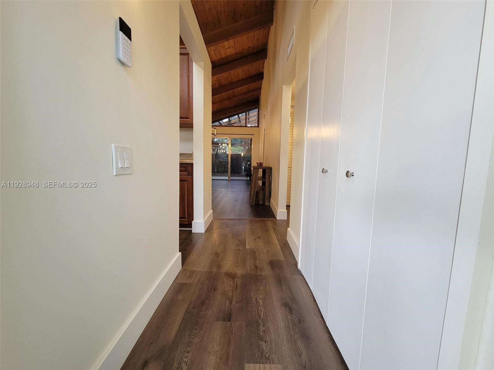 11375 Southwest 112th Cir Lane South Miami, FL 33176 - Photo 6 of 55 a view of a hallway with wooden floor and staircase
