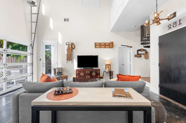 a kitchen with stainless steel appliances kitchen island granite countertop a stove and white cabinets
