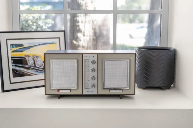 a bedroom with a bed and a television