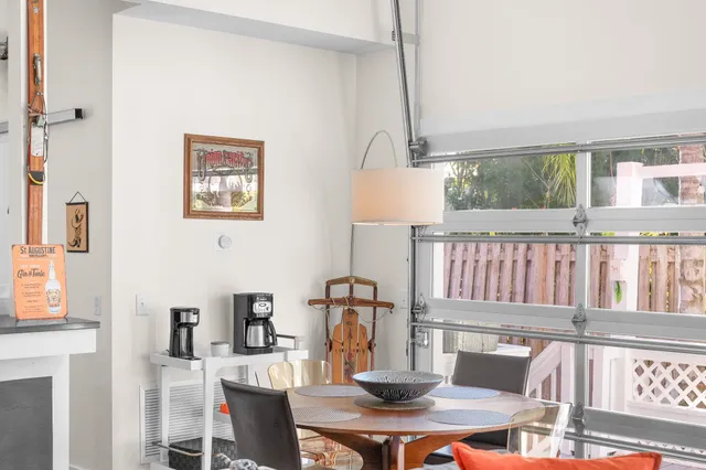 a bedroom with a bed and a flat tv screen on dresser