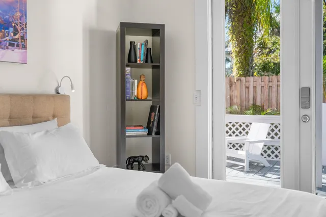 a white toilet sitting next to a bathroom sink and a tub