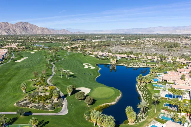 a living room with fireplace furniture and a flat screen tv