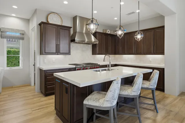 a spacious bathroom with a double vanity sink a mirror a bathtub and a shower