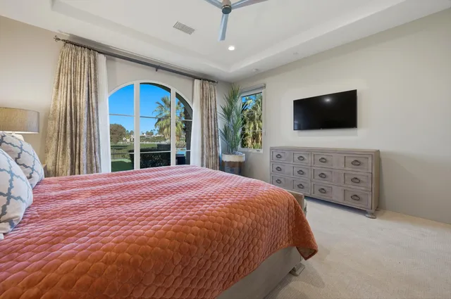 a bedroom with a bed and a chair