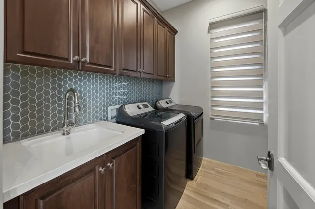 a view of a dining room with furniture and a large window