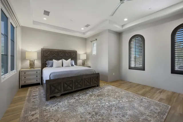 a front view of a house with a yard and fountain