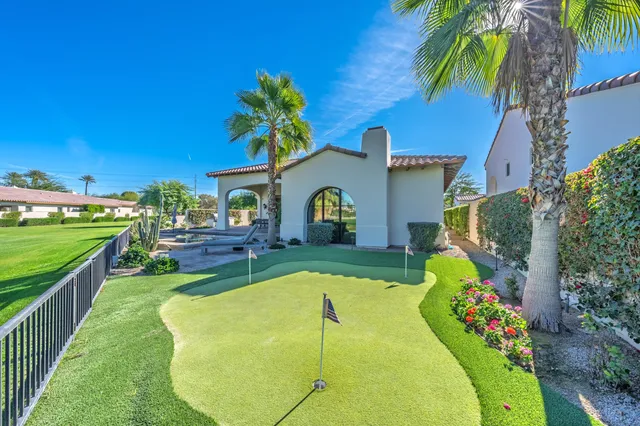 a view of a patio with couches chairs and potted plants