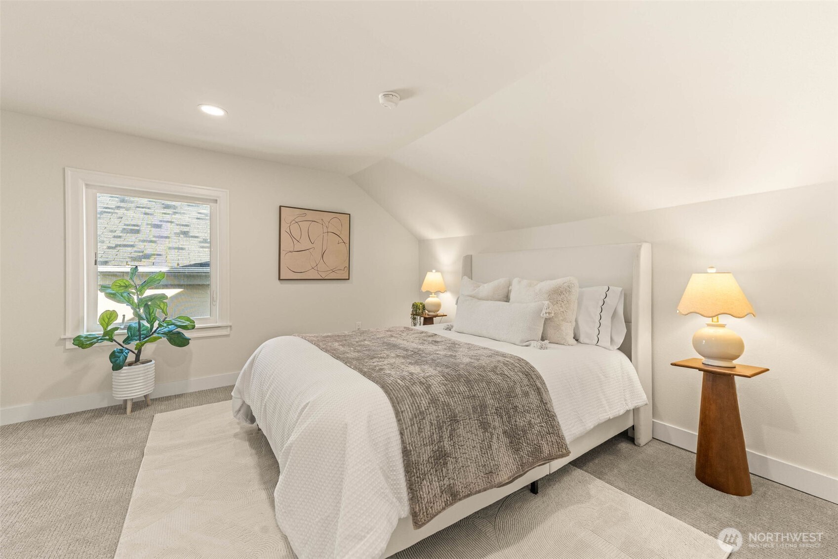 1520 31st Avenue Seattle, WA 98122 - Photo 13 of 27 a bedroom with a bed and painting on the wall