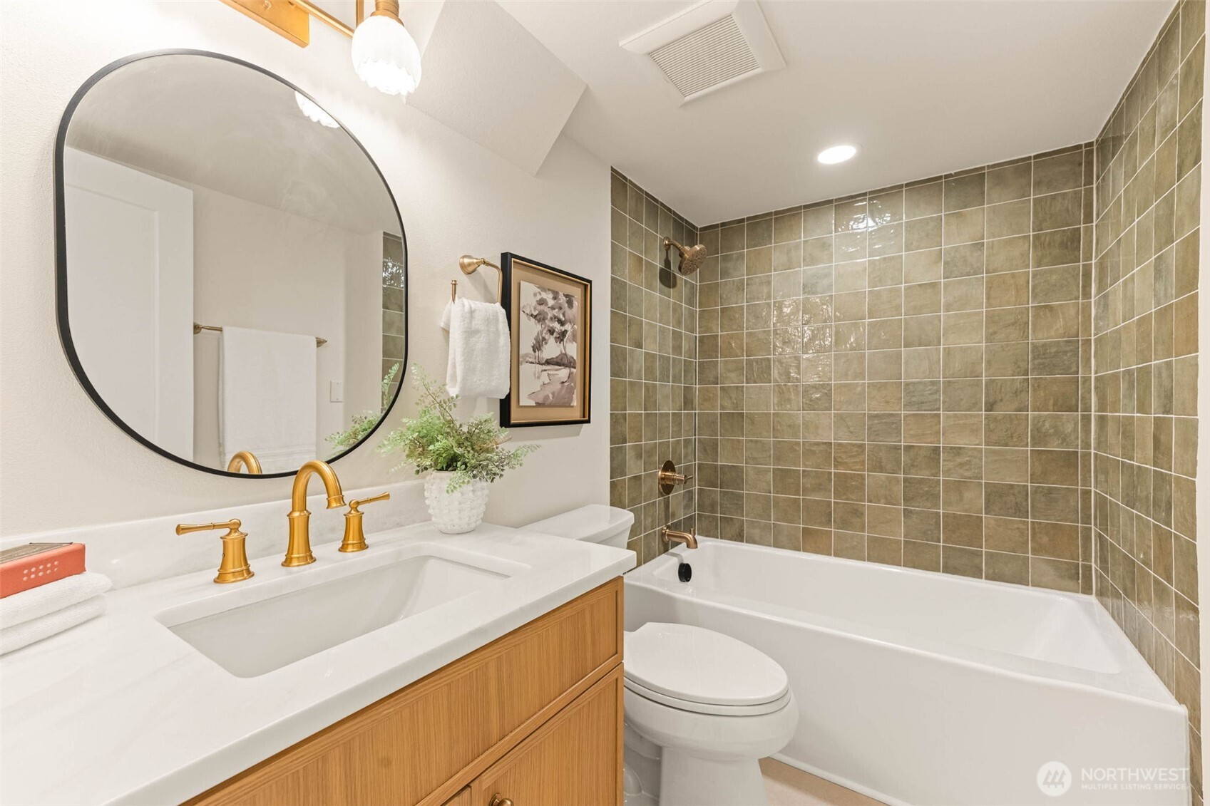 1520 31st Avenue Seattle, WA 98122 - Photo 17 of 27 a bathroom with a sink a toilet and a mirror