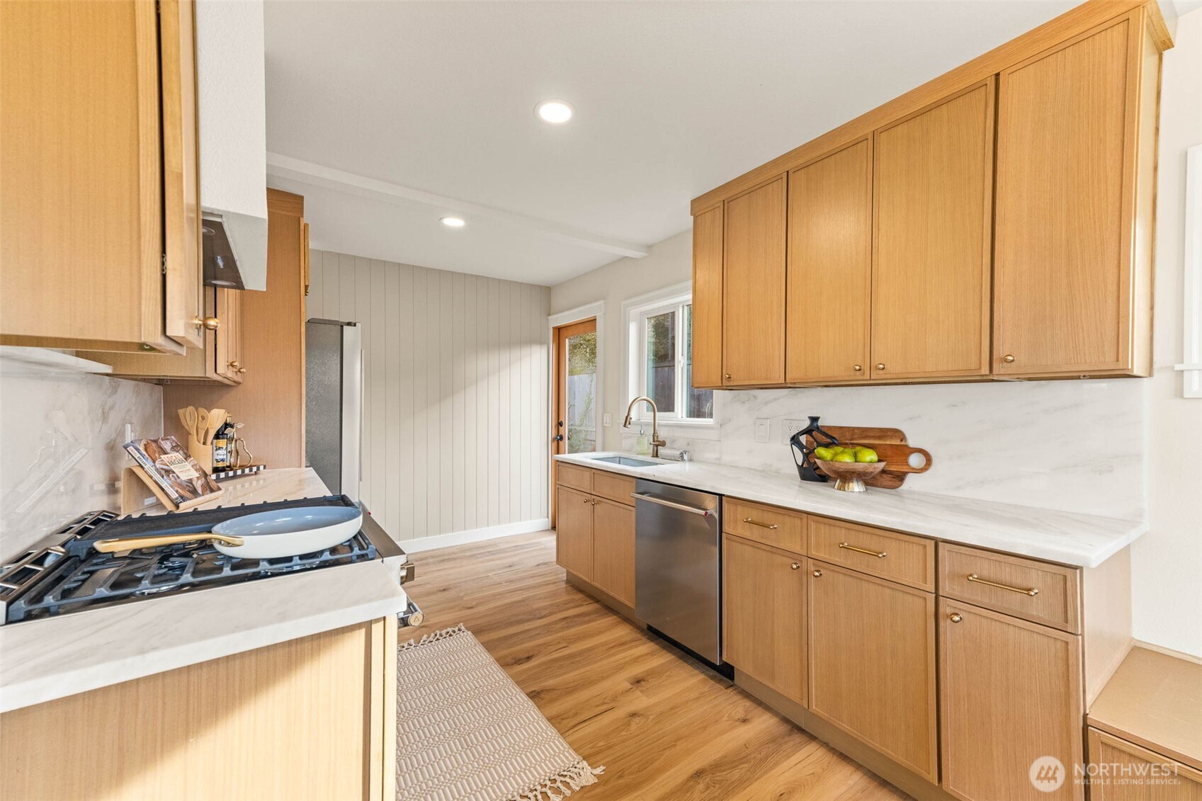 1520 31st Avenue Seattle, WA 98122 - Photo 5 of 27 a kitchen with a sink stove and cabinets