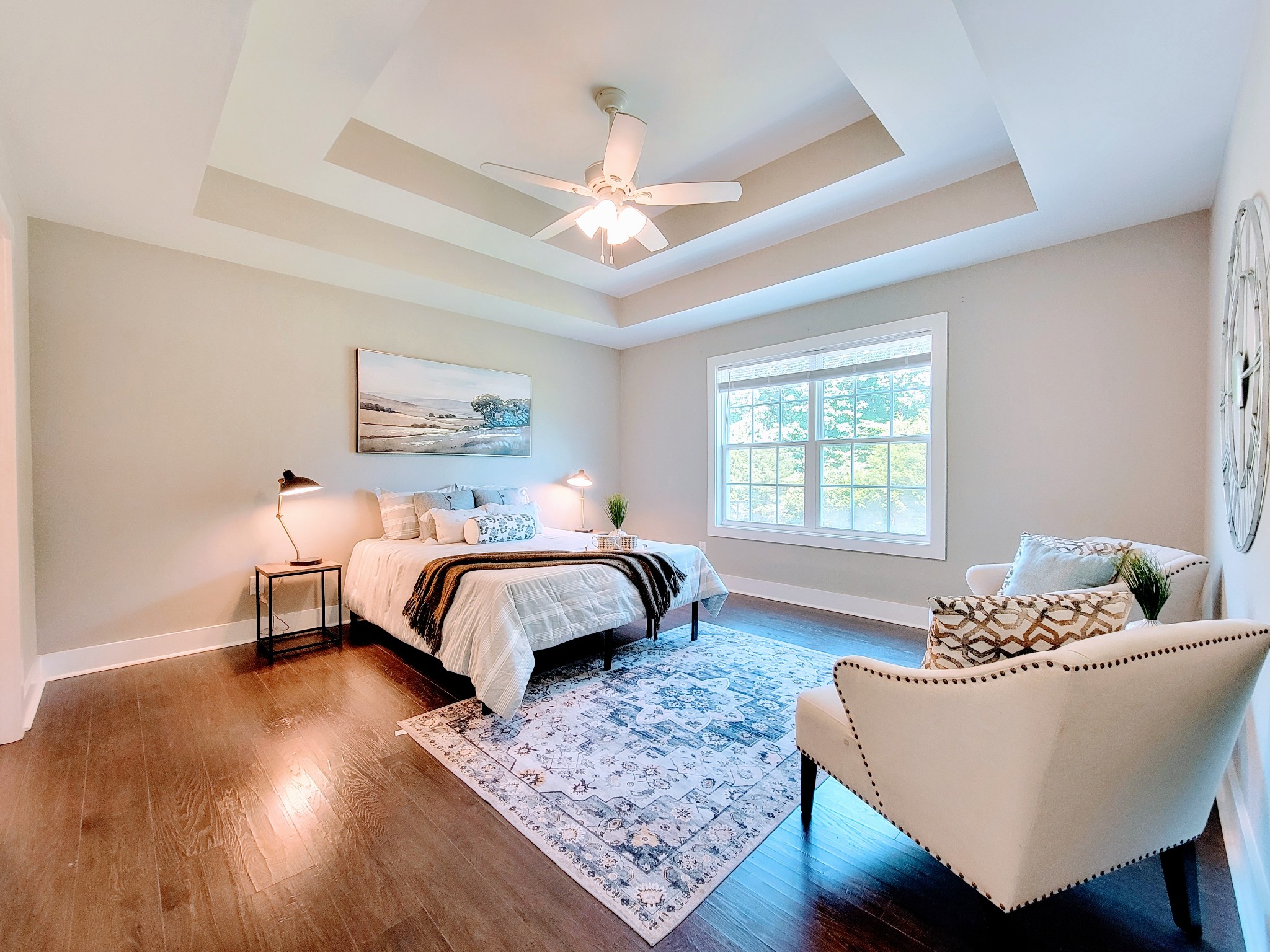 961 Big Springs Road Charlotte, TN 37036 - Photo 22 of 50 The large primary bedroom features the same double trey ceilings and bright double windows.