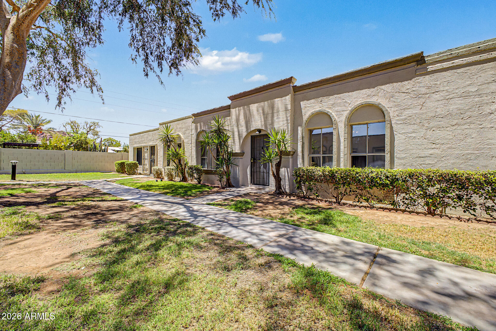 5873 East Thomas Road Scottsdale, AZ 85251 - Photo 2 of 30 a front view of a house with garden