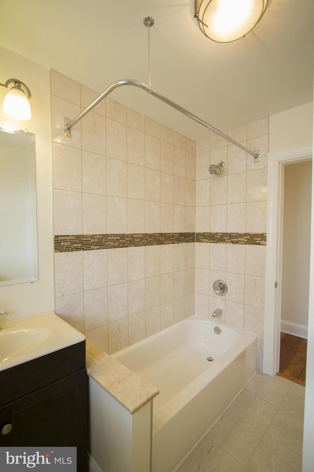 6825 Dunhill Road Baltimore, MD 21222 - Photo 22 of 30 a bathroom with a sink and a bathtub