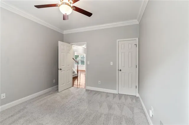 a bathroom with a sink a toilet a mirror and shower