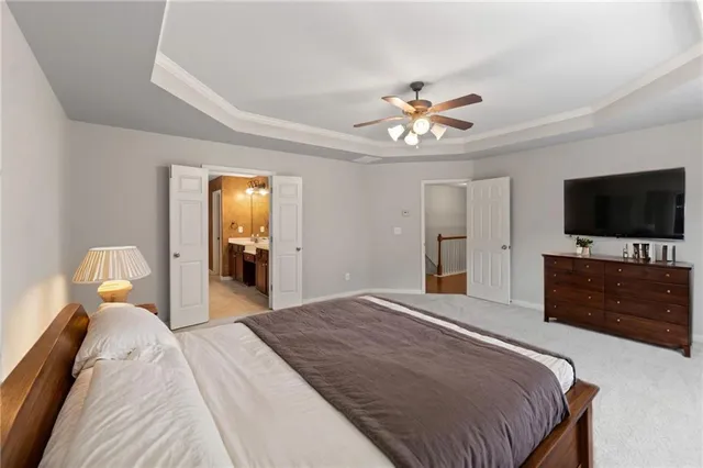 a spacious bathroom with a granite countertop sink and a mirror