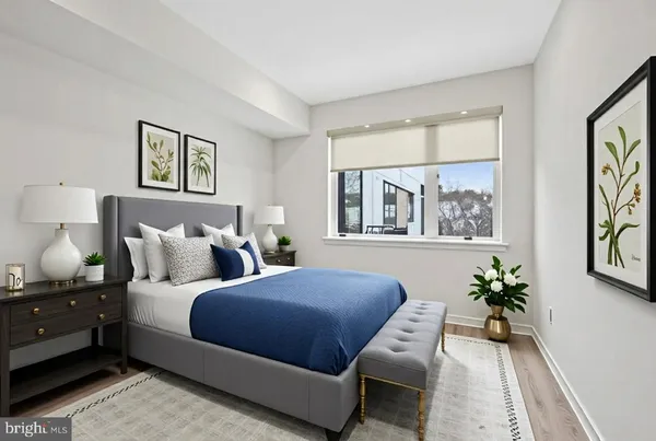 a bedroom with a large bed and a window