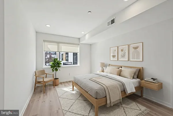 a bedroom with a bed and a table