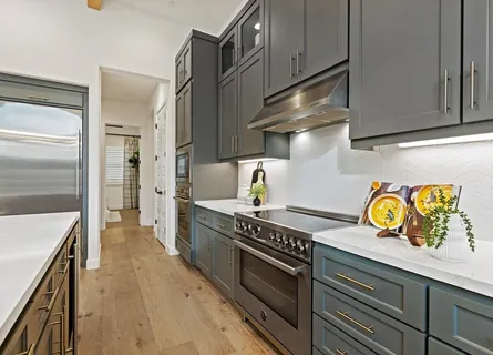 a kitchen with a sink and center island