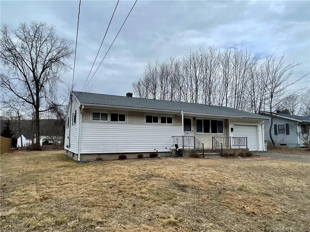 128 Beacon Manor Road Naugatuck, CT 06770 - Photo 1 of 1 a front view of a house with a yard