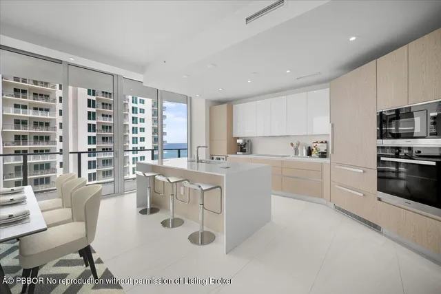 a kitchen with counter top space cabinets and stainless steel appliances
