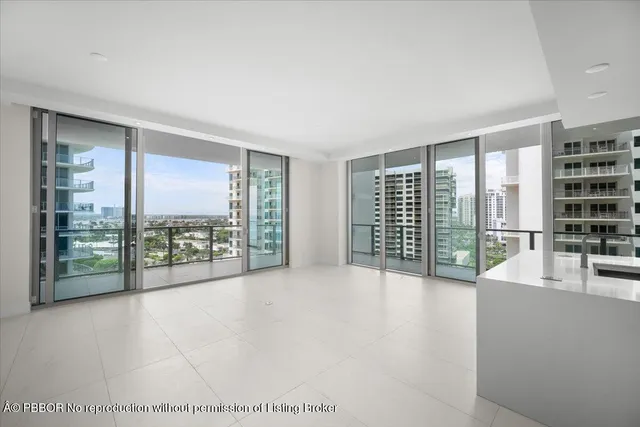 a view of an empty room with a balcony